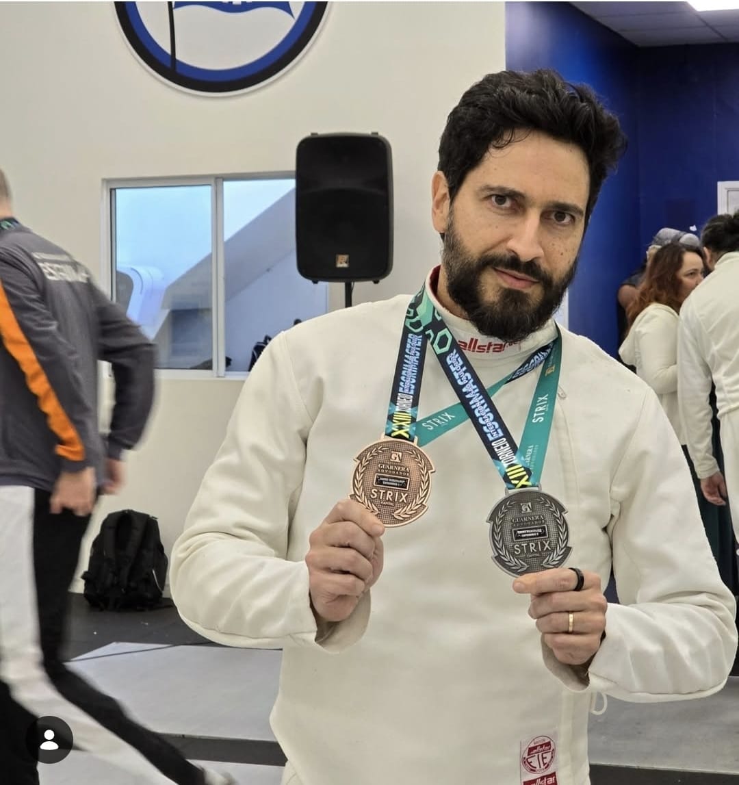Ronaldo Lemos with fencing medals